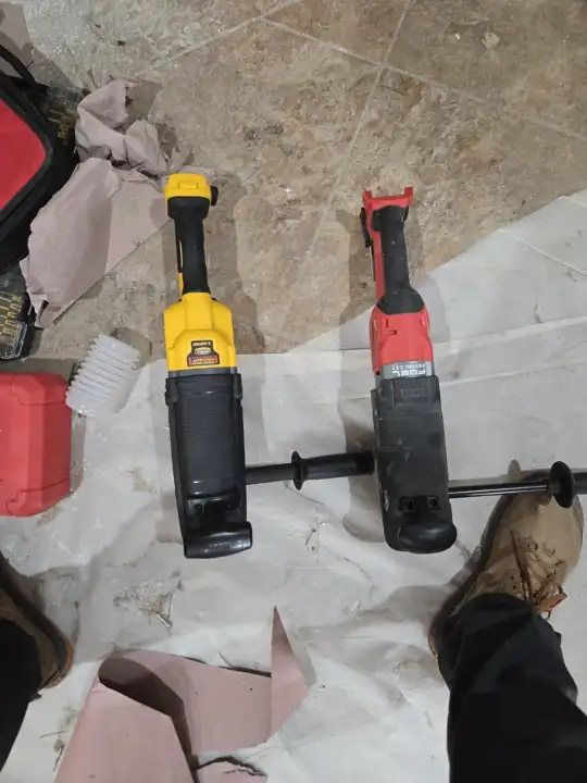 DeWalt FLEXVOLT stud and joist drill next to Milwaukee Super Hawg