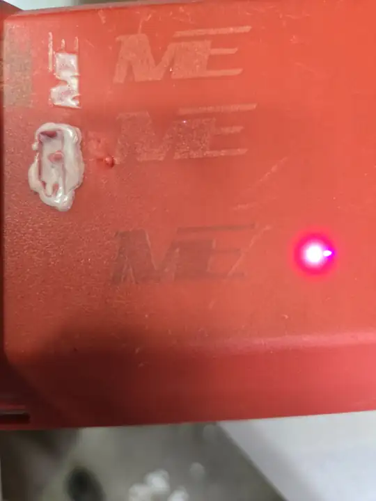 Our logo going onto a red tool case on the xTool F2