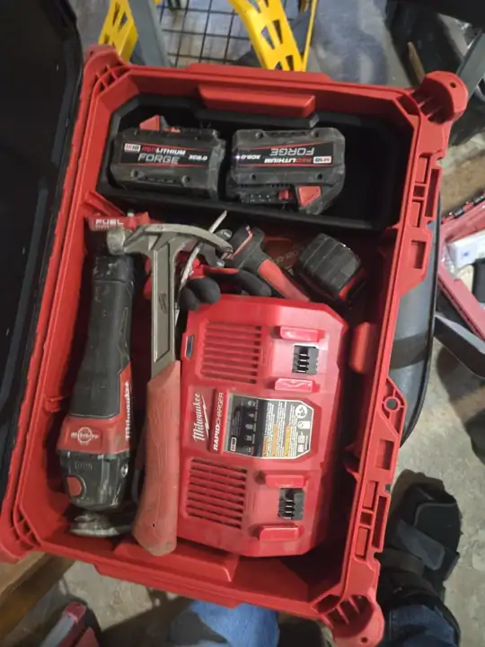 PACKOUT organizer loaded: batteries, rapid charger, hammer