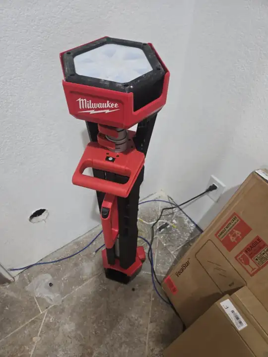 M18 ROCKET tower light lighting a room