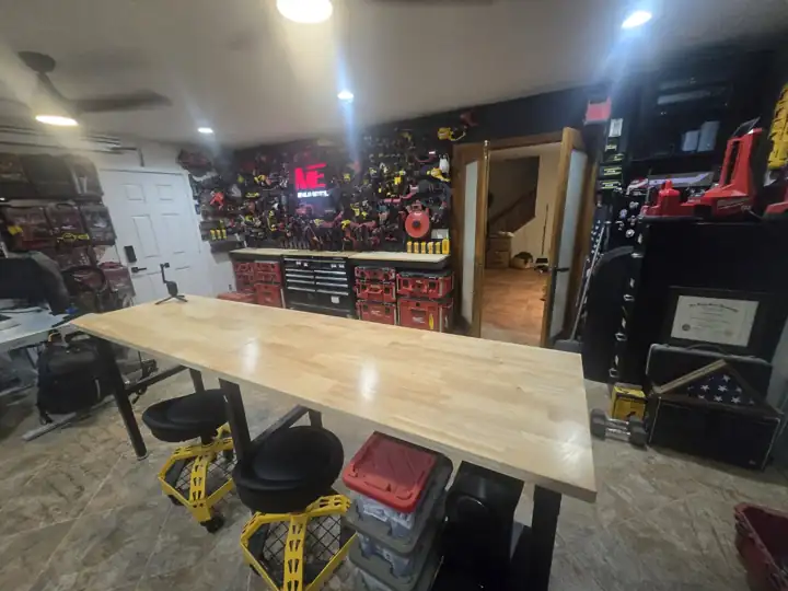 The long butcher-block bench where tools get unboxed